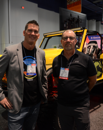 The Owner with Jeff from Bronco Graveyard in front of the yellow bronco at SEMA