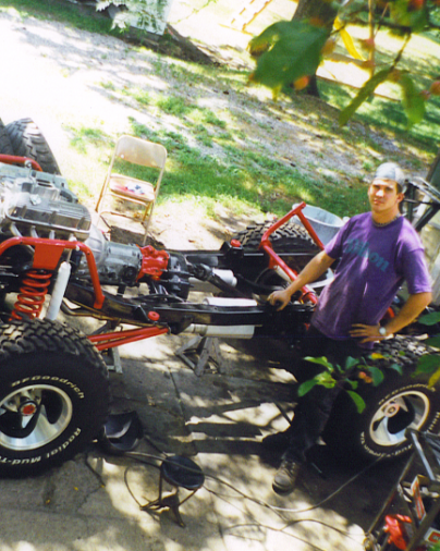 The Owner with Jeff from Bronco Graveyard in front of the yellow bronco at SEMA