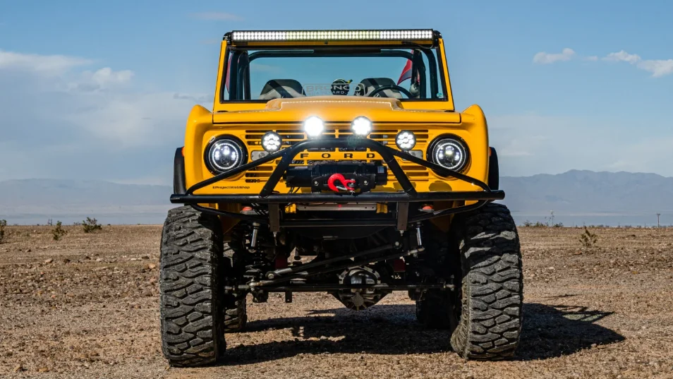 Front View of Dana Nevins Yellow 1970 Ford Bronco with King Shocks and Atturo Tires