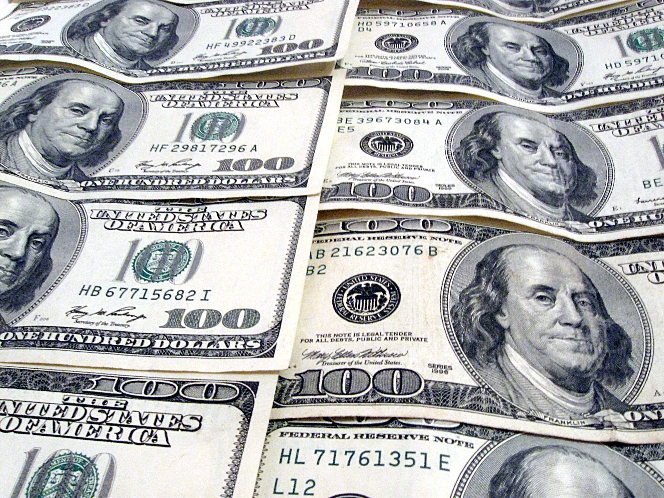 Image of cash and coins representing sales and profit for an eCommerce business