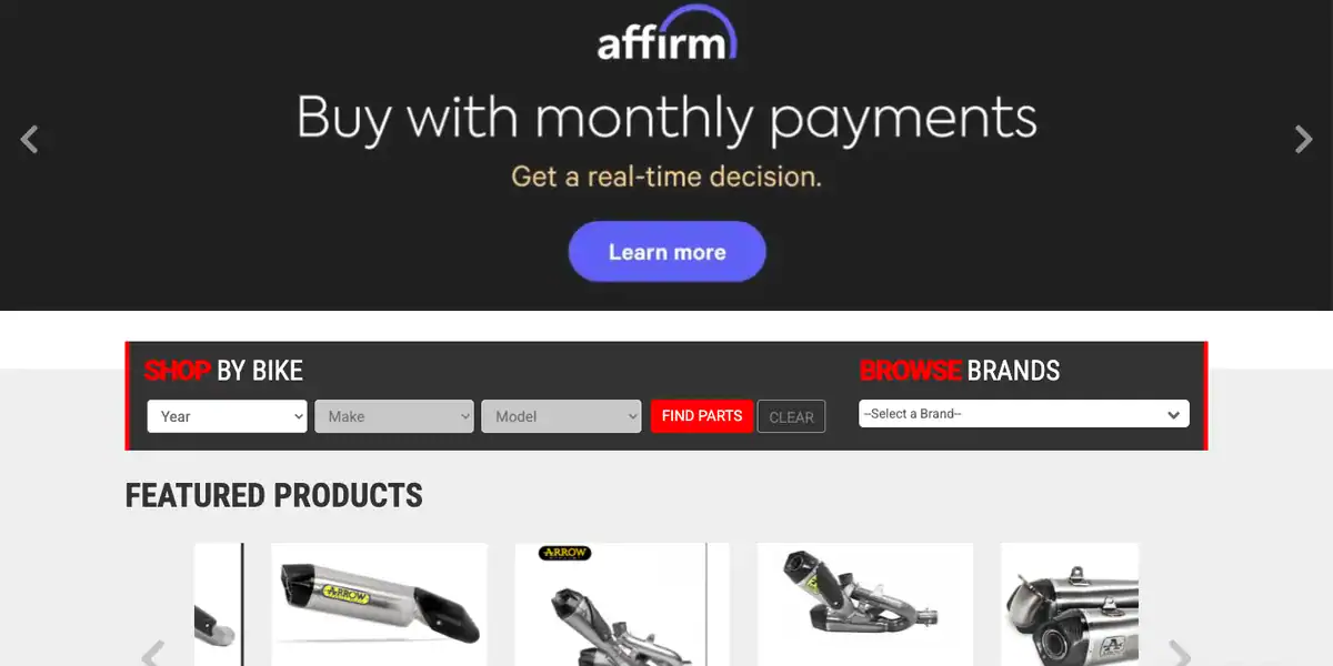 Motowheels home page with the Shop By Bike year, make and model search next to a Browse Brands menu